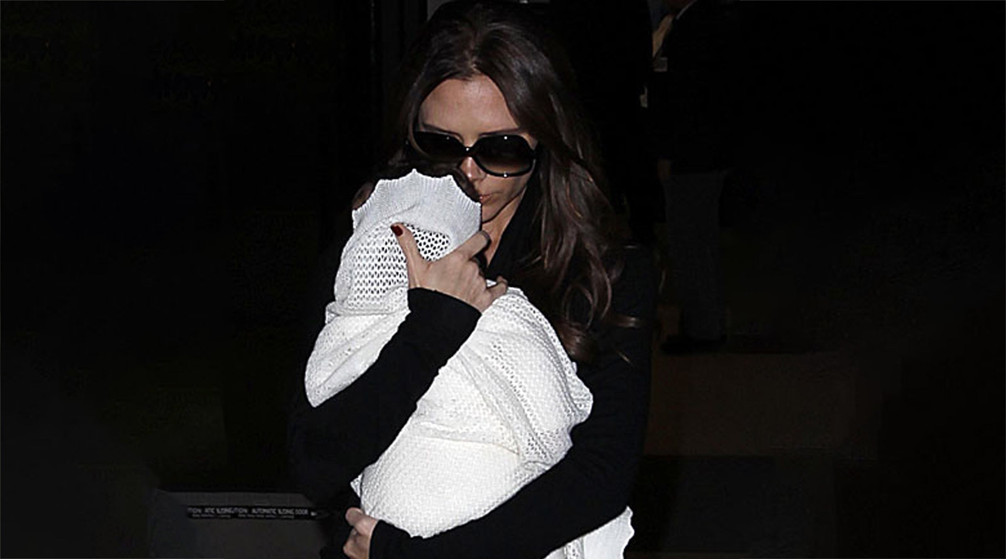 Victoria Beckham pictured with Harper wrapped in a G.H.Hurt & Son Baby Shawl